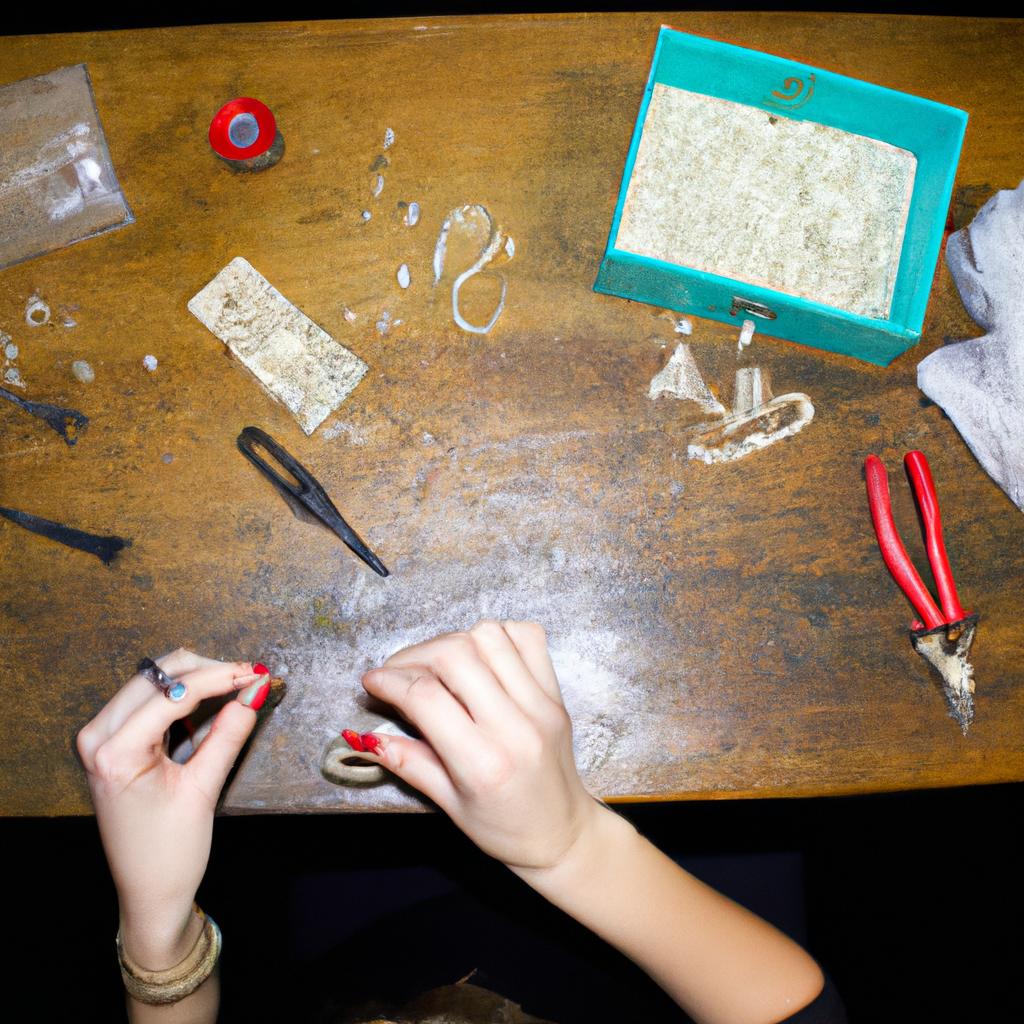 Person crafting jewelry with tools