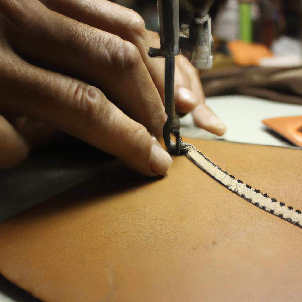 Person stitching leather with precision