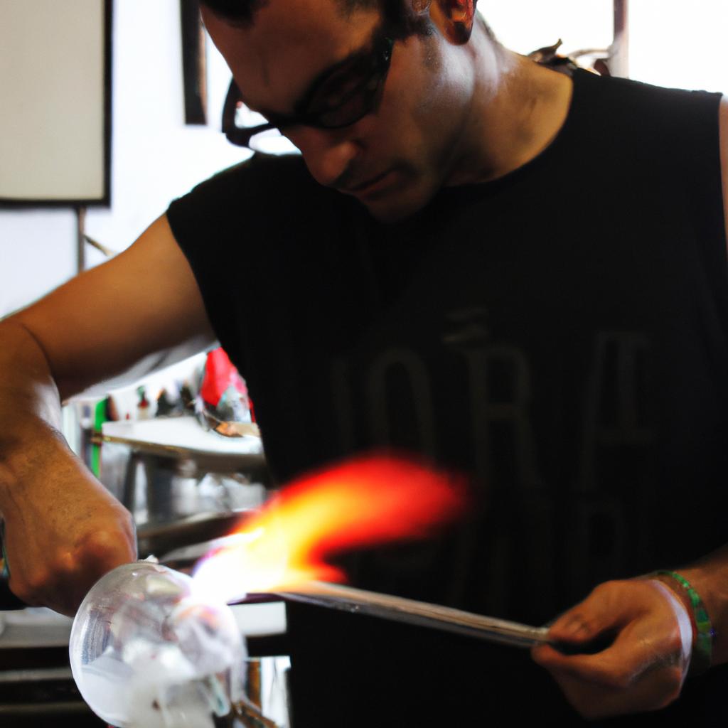 Person blowing glass with precision