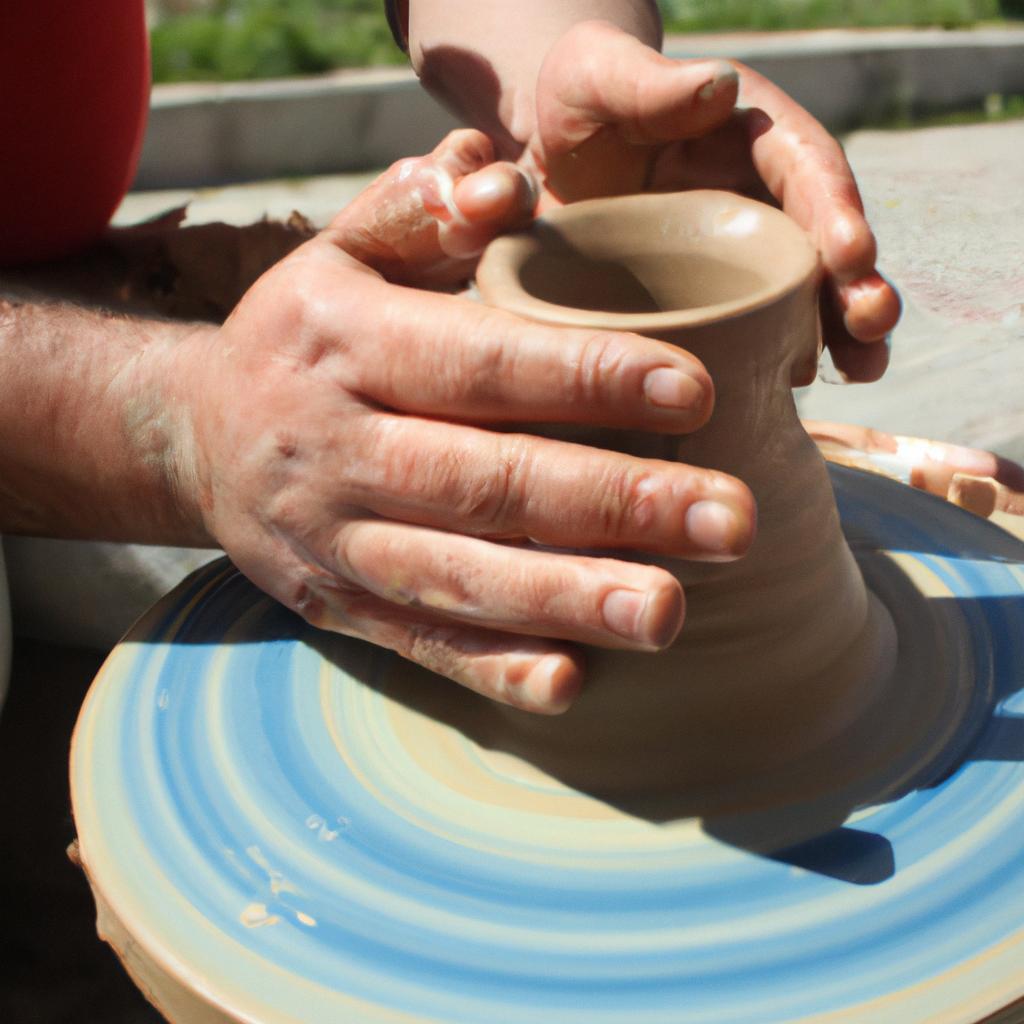 Person throwing pottery on wheel
