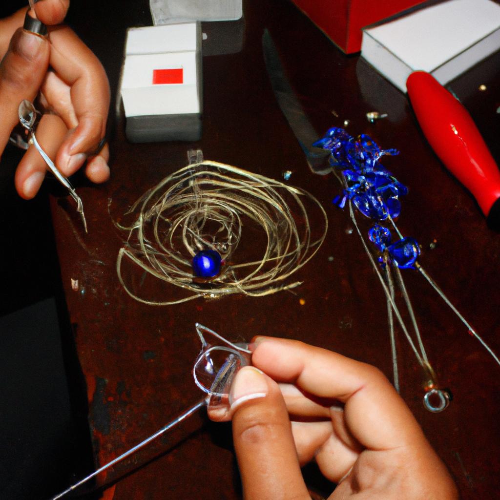 Person crafting wire jewelry skills